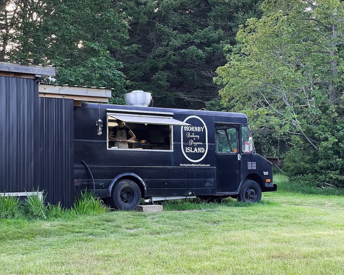 Hornby Island Bakery Pizzeria food truck preparing wood-fired pizzas on Hornby Island.