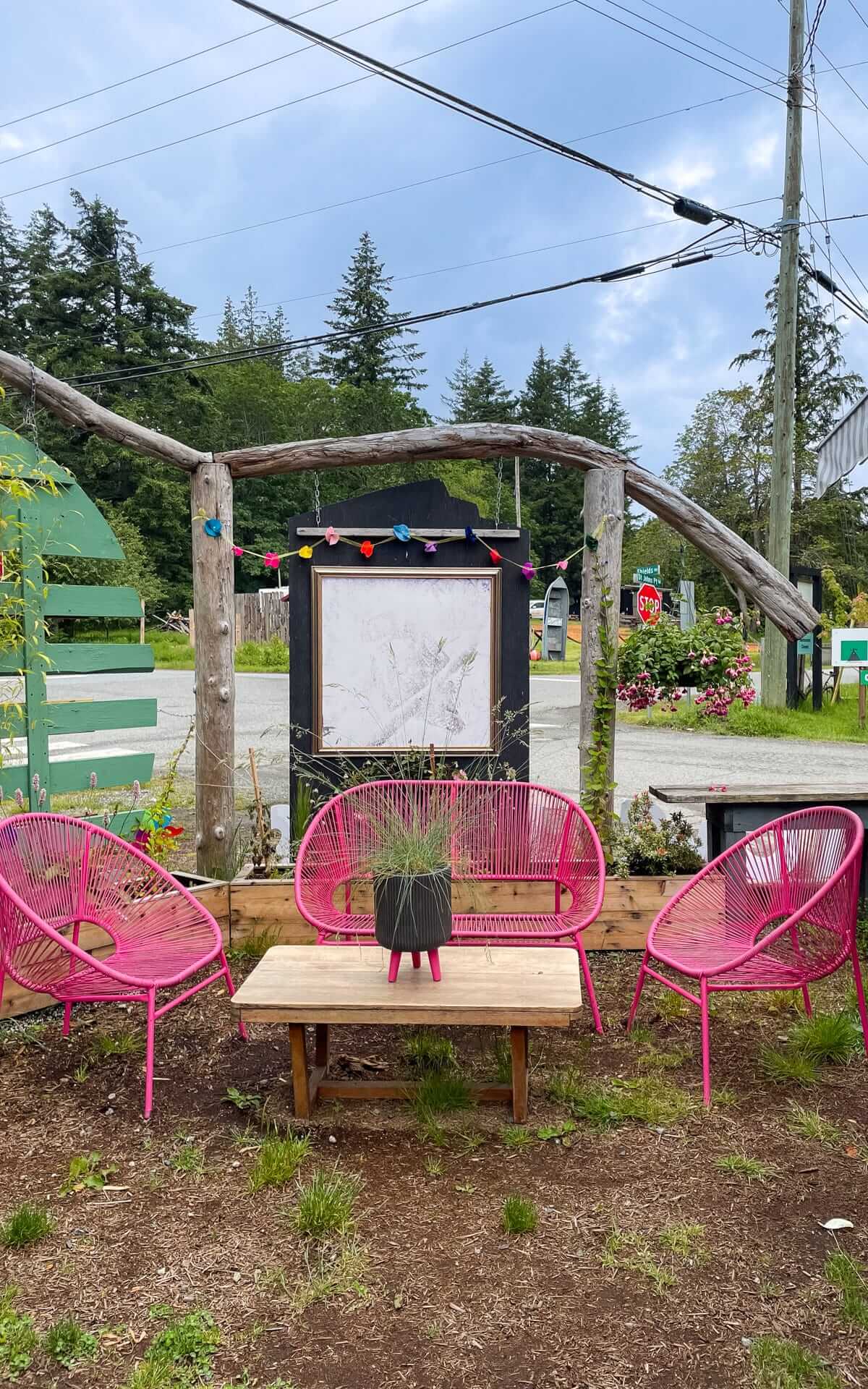 Bright pink outdoor seating area outside of Hummingbird Bread Bo. on Hornby Island.