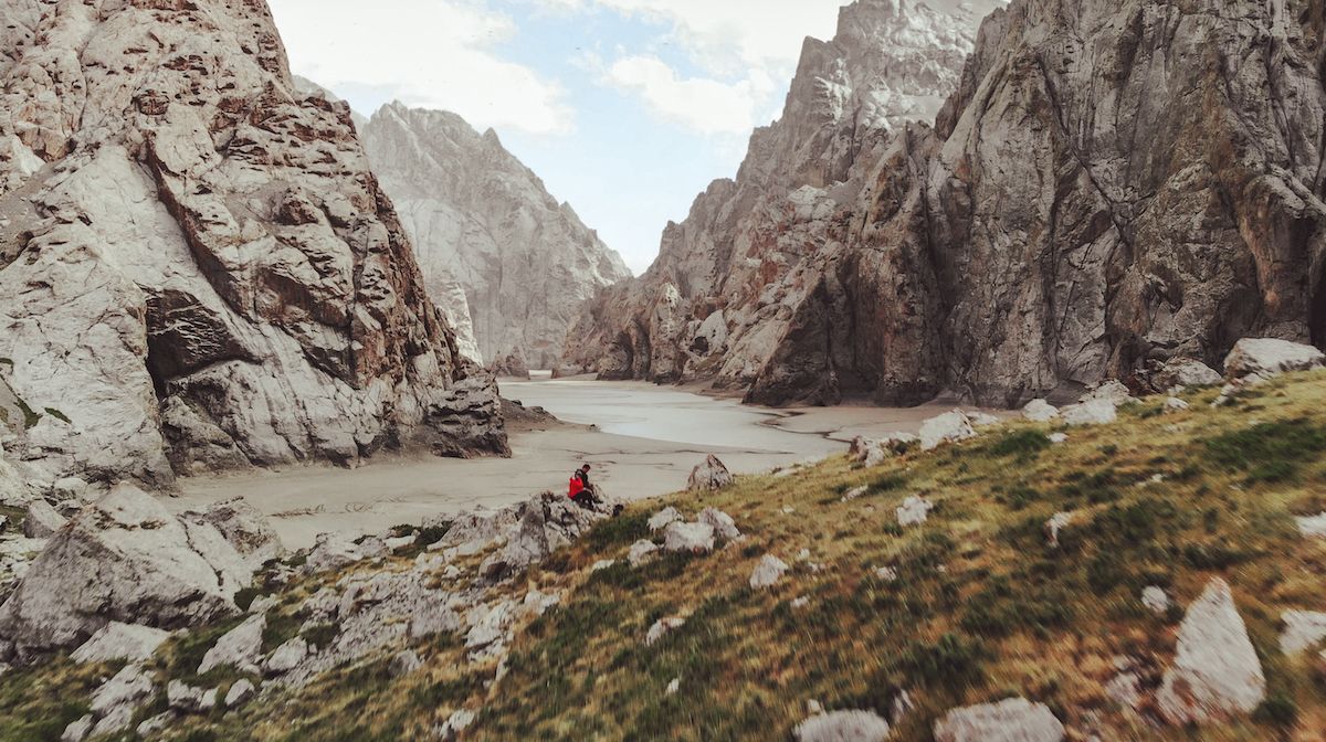 Ari and Cec sitting at Kel-Suu Lake on their trip through Kyrgyzstan.