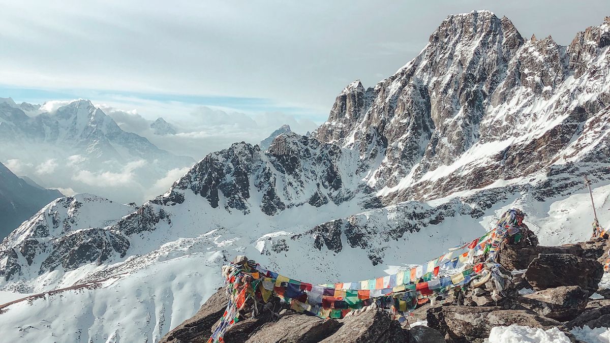 Panoramic view of snowy Himalayan peaks at the summit of Gokyo Ri at 5,357m altitude on the Gokyo Lakes trek in Nepal. 