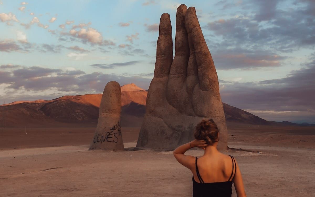 The Hand of the Desert sculpture in the Atacama Desert, one of the best activities to add to your Chile itinerary.