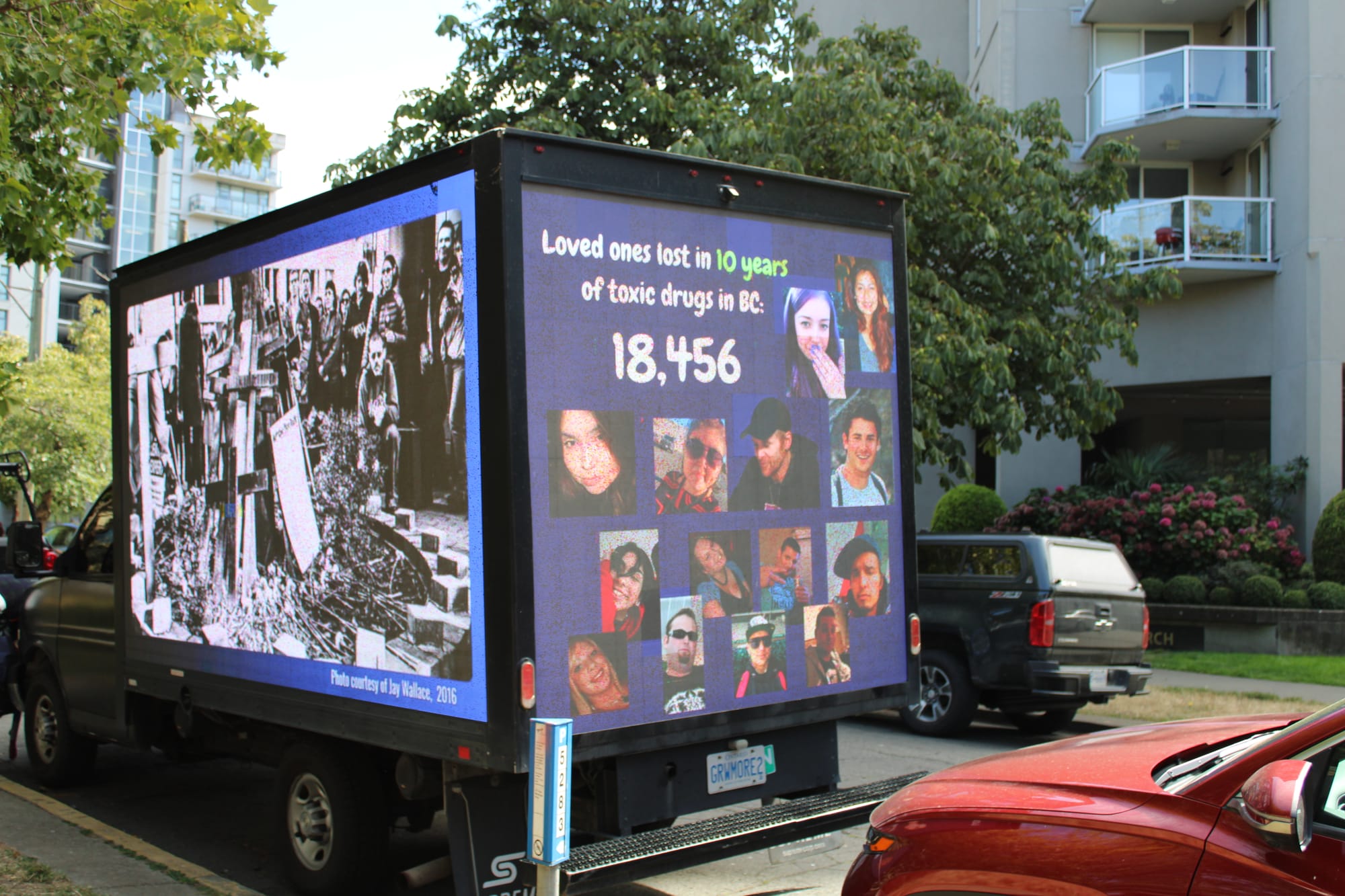 A memorial truck with billboards on all sides displayed the faces of lives lost to the toxic drug crisis in the last 10 years. 