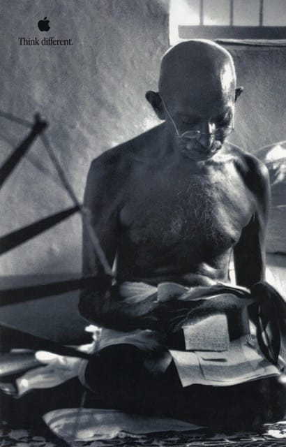 Mahatma Gandhi tends to his homespun in Apple's promotional poster from 1997