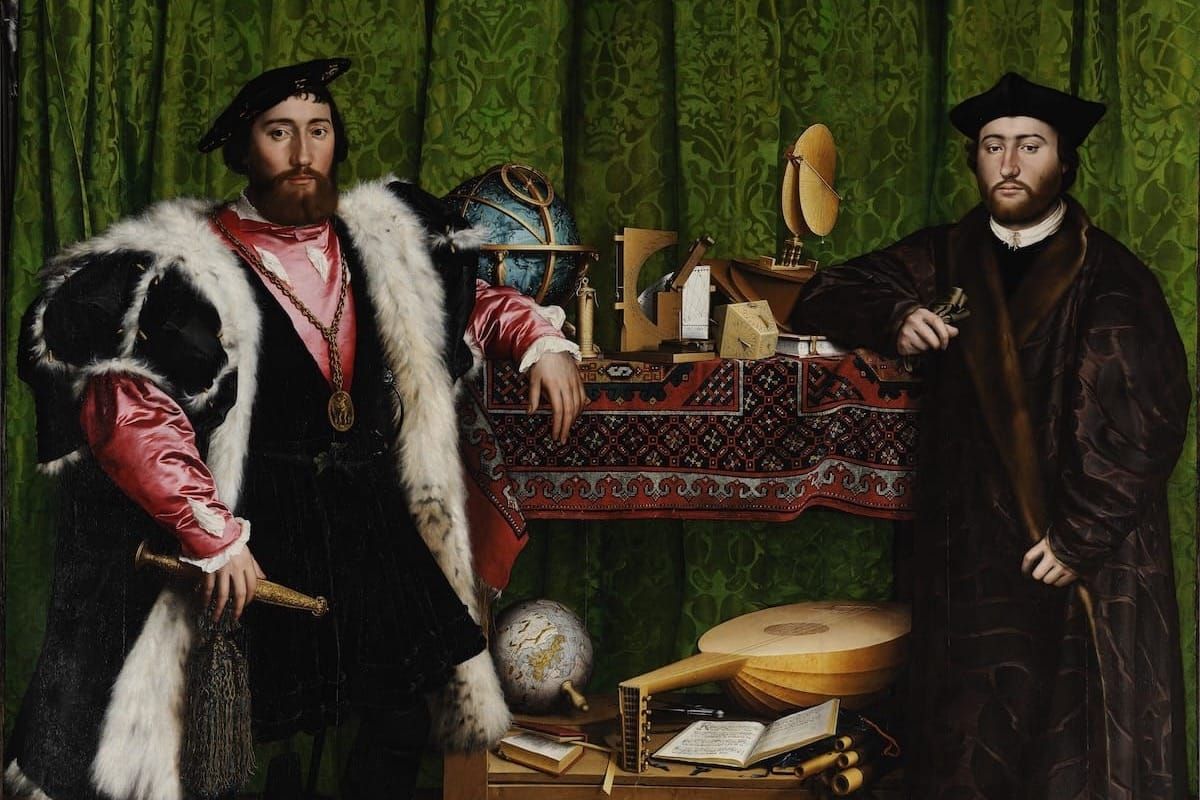 Two Renaissance diplomats in rich attire flank a table laden with globes, scientific instruments, a lute, and books — the tools of their multilateral craft.