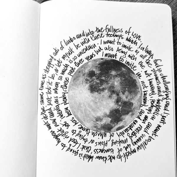 Spiral writing around a moon shape in a notebook by Sophie Nicholls