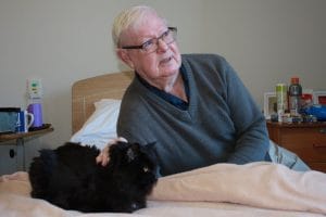 HammondCare Darlinghurst resident Kenny with his cat, Willow