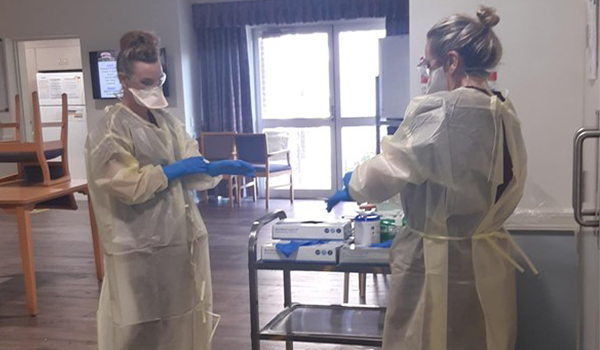 This is the CEO and COO of Southern Cross Care (NSW & ACT) working on the floor post image