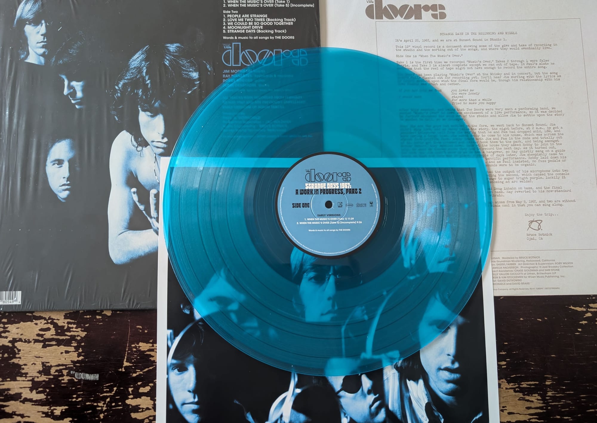 Back cover, inner sleeve, poster print and disc for the Doors.