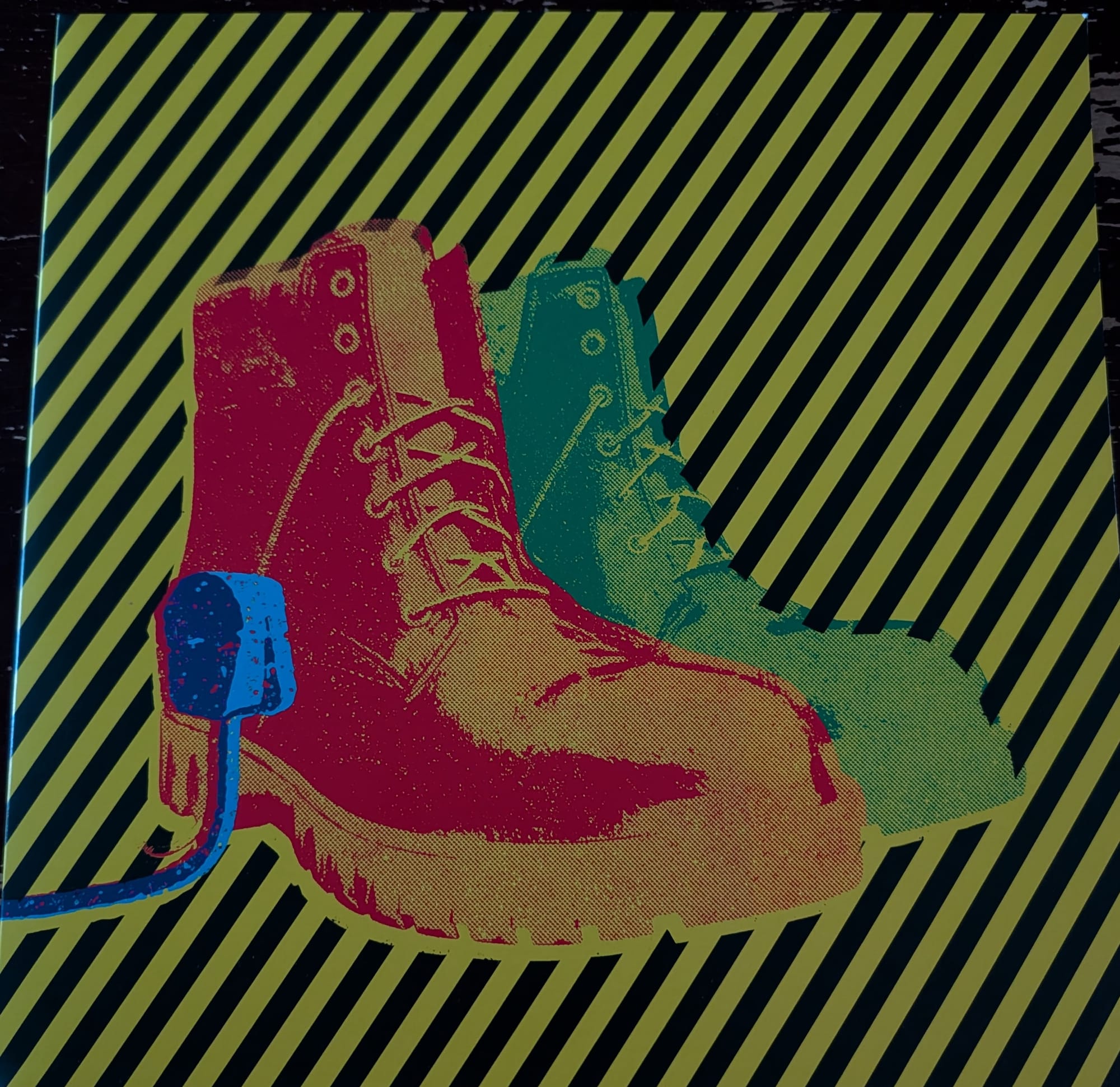 the cover for XTC's Live Boots release