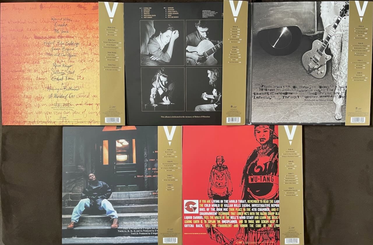 Back covers for Counting Crows, the Cranberries, Sheryl Crow, D'Angelo, and GZA.