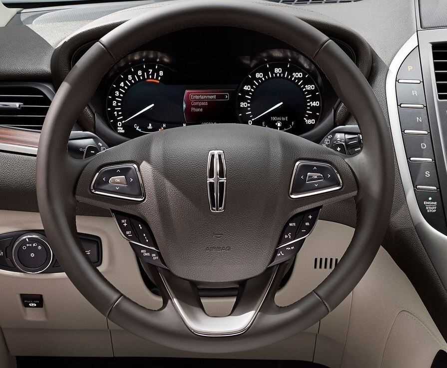  2015 model shown (notice the engine start/stop button has since been moved away from the Drive and Sport Mode buttons) 