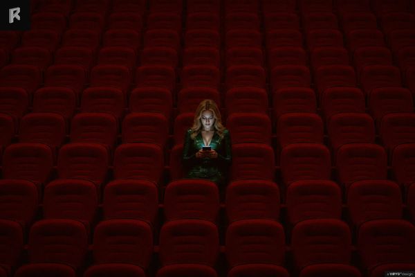 A women watches vertical drama pictured by Real-Reel.com
