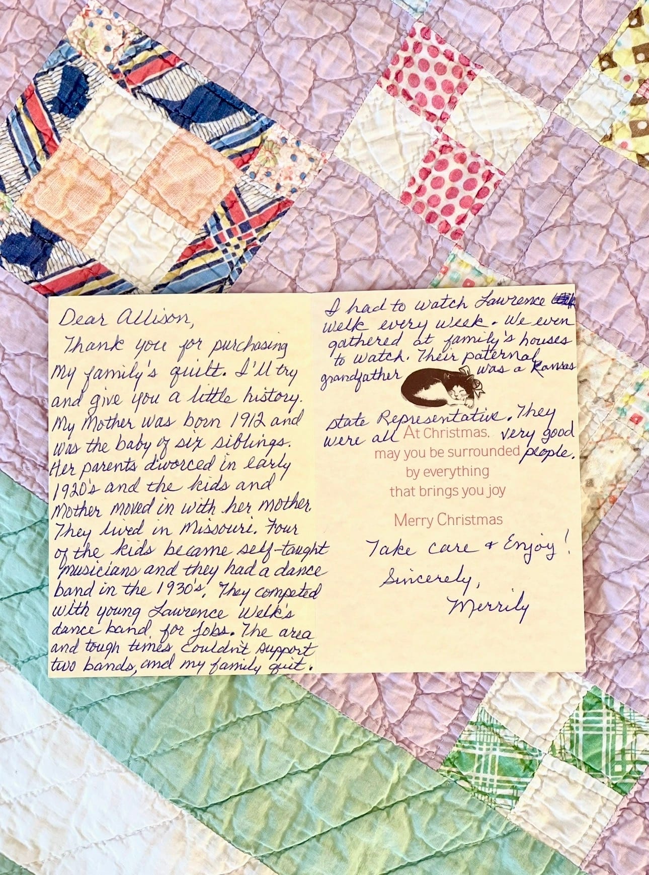 A handwritten note from a previous quilt owner rests on a pastel patchwork vintage quilt, sharing the family history behind the heirloom piece.