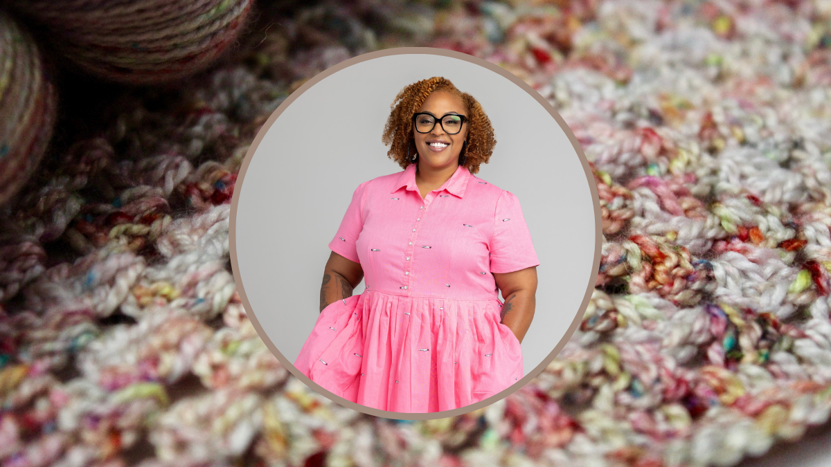 The image shows a circle frame with a person with curly hair wearing glasses and a joyful expression. The frame is centered on a close-up of a multicolored crochet pattern with yarn skeins.