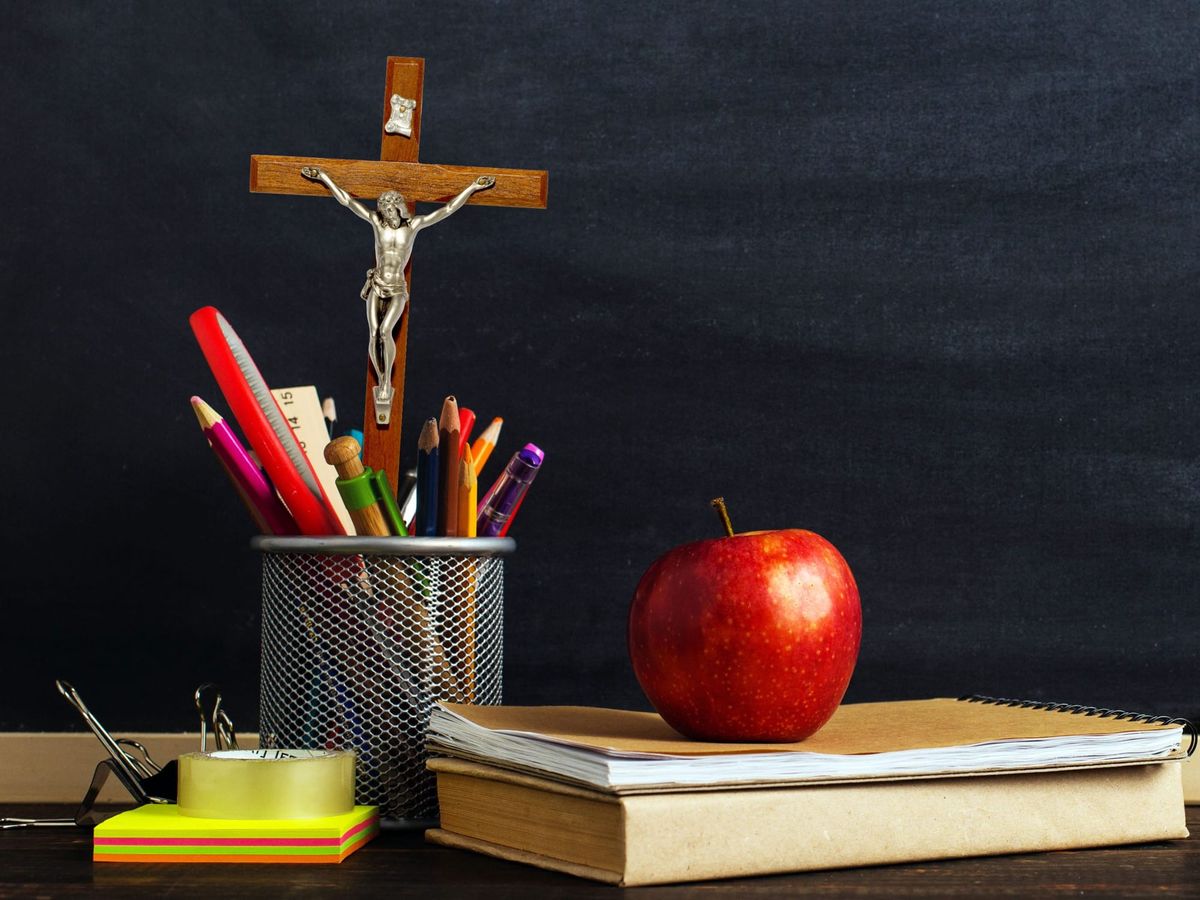 Religious iconography on top of a school desk