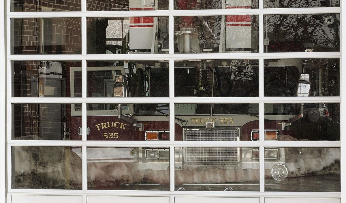 A firetruck seen through glass windows