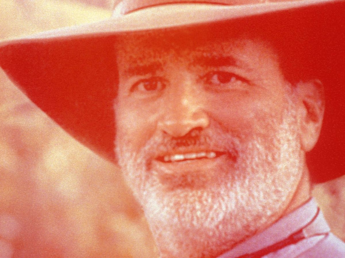 red-tinted close-up of Terrence Malick’s face