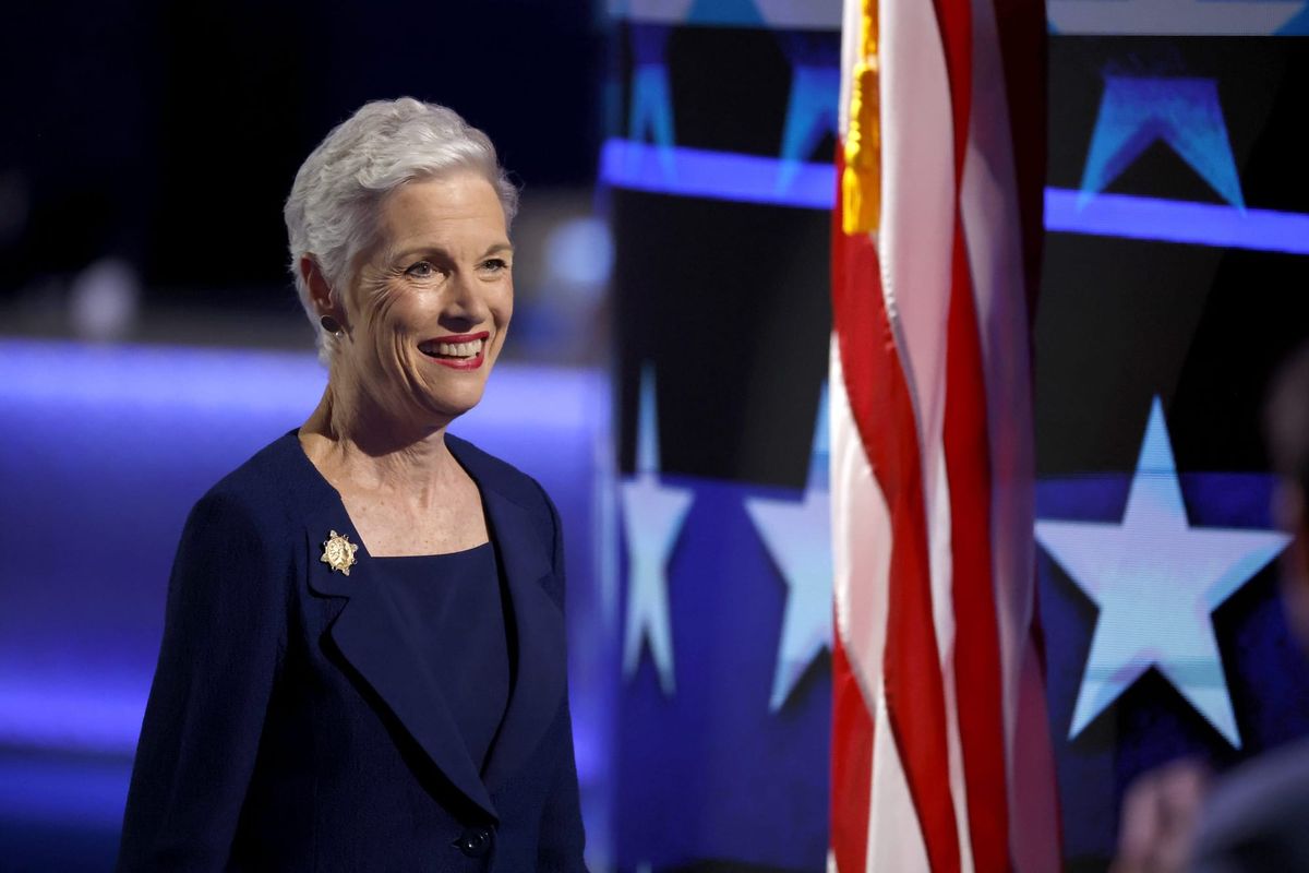 Cecile Richards standing next to the American flag