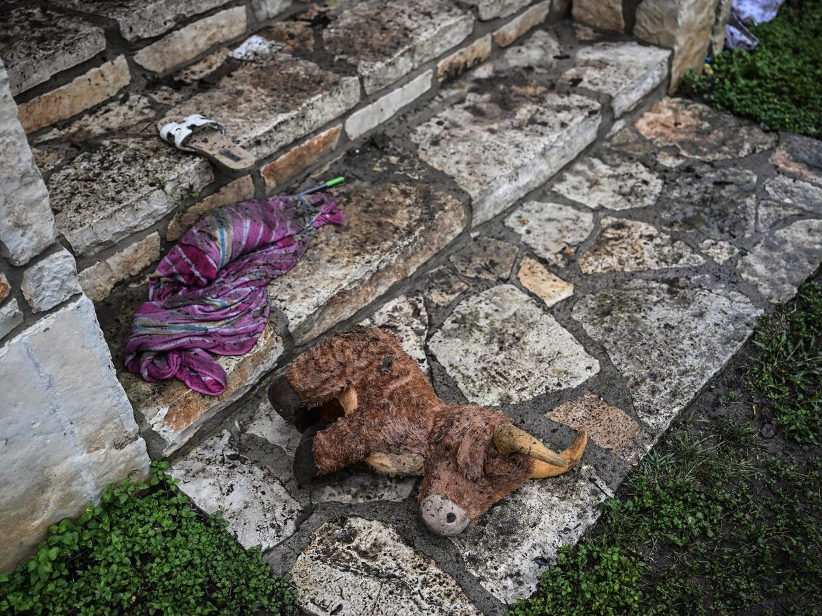 A plush toy sits on the ground outside of a cabin at Camp Mystic, the site of where at least 20 girls went missing after flas