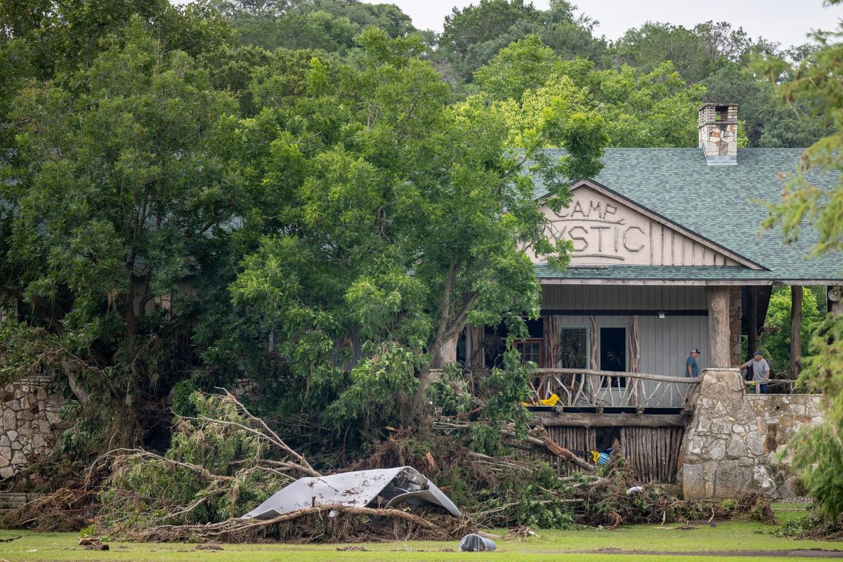 Debris is piled up at the entrance to Camp Mystic on July 07, 2025 in Hunt, Texas. (Photo by Brandon Bell/Getty Images)