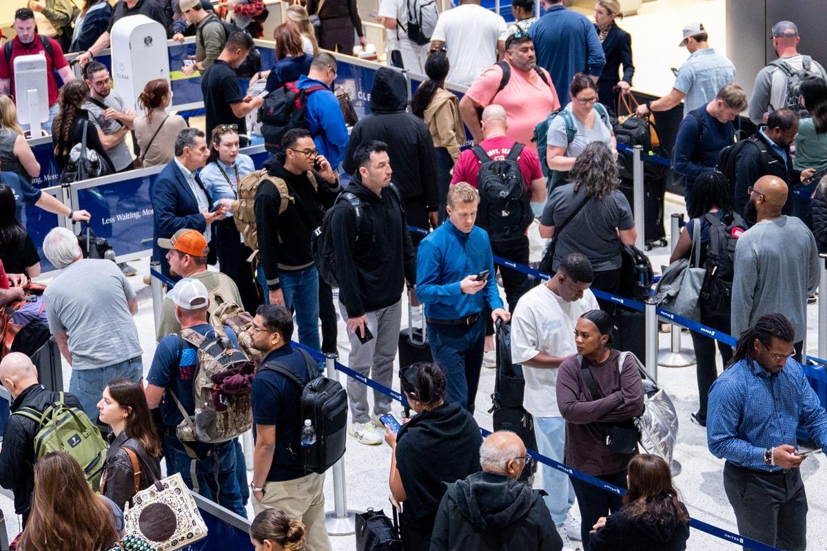 People wait in line at a security checkpoint at the George Bush Intercontinental Airport on Nov. 6, 2025 in Houston, Texas. F