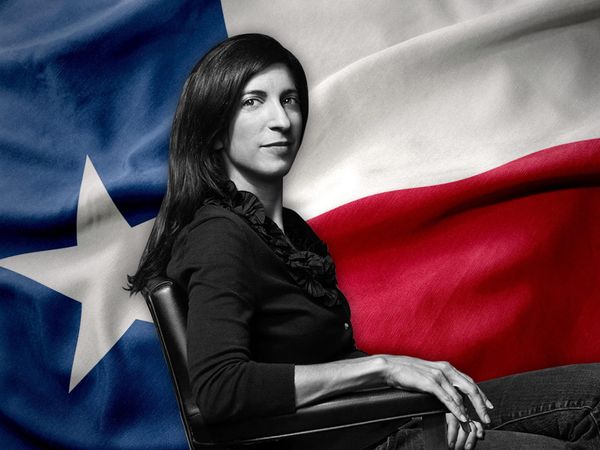 a photo of Pamela Colloff sitting in front of a Texas flag