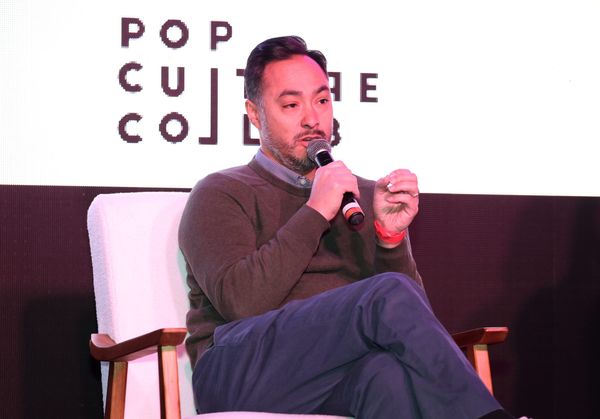 Joaquin Castro speaks on stage into a microphone