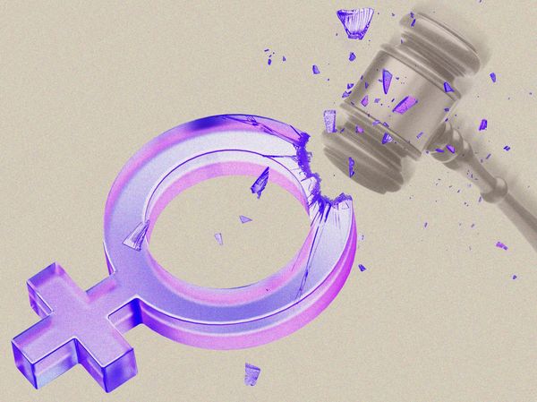 the sign for female in purple, on a beige background, being shattered by a gavel
