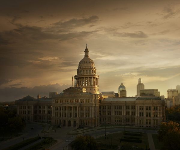 A view of the Texas Capitol at sunset