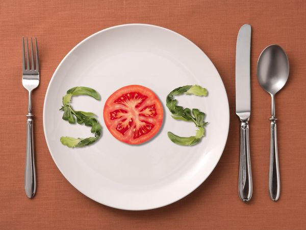 food spelling out “SOS” on a plate