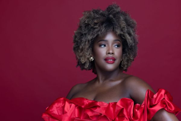 She Went Viral Challenging ‘Professional’ Hair Standards. Now, She’s Teaching Fellow Femmes to Be Loud.