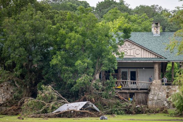 Debris is piled up at the entrance to Camp Mystic on July 07, 2025 in Hunt, Texas. (Photo by Brandon Bell/Getty Images)