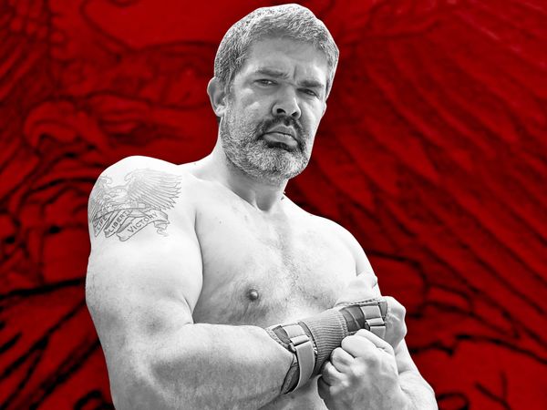 Jason Lee Van Dyke, shirtless on a red background