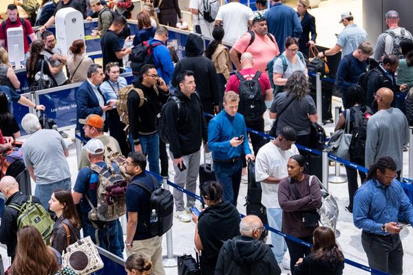People wait in line at a security checkpoint at the George Bush Intercontinental Airport on Nov. 6, 2025 in Houston, Texas. F