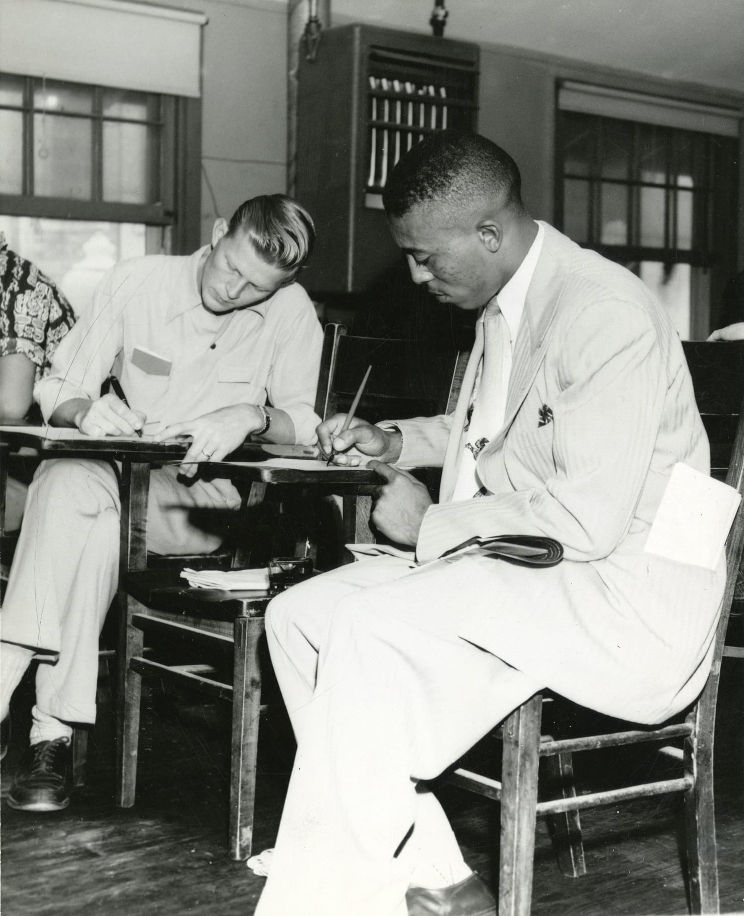 John Chase (right) in a classroom on the campus of The University of Texas at Austin, 1950. UT Texas Student Publications Photographs, Dolph Briscoe Center for American History, the University of Texas at Austin.