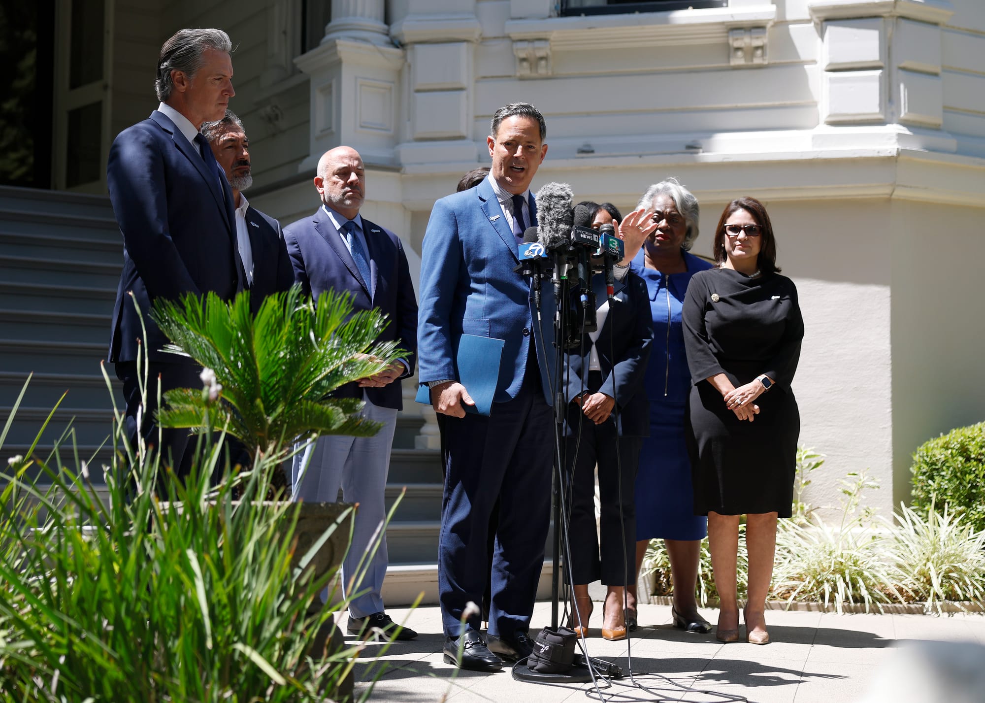 Texas Rep Rafael Anchia (C) speaks during a news conference with California Gov. Gavin Newsom and Texas lawmakers at the Governor’s Mansion.