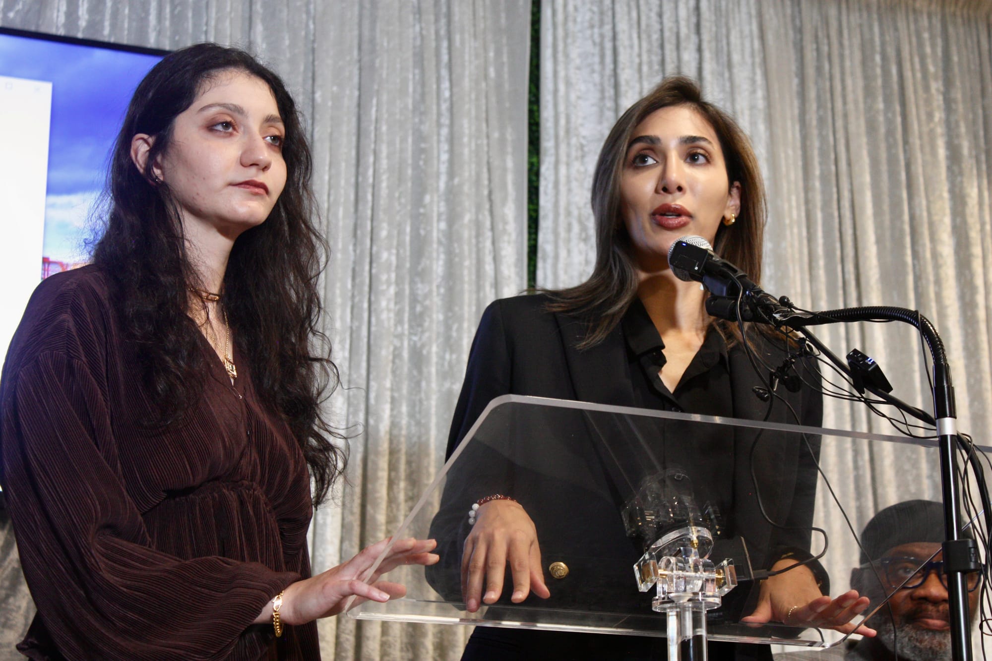Ward Sakeik and her attorney, Maria Kari, speak at a press conference at the Wyndham Hotel in Irving, Texas on July 3, 2025.