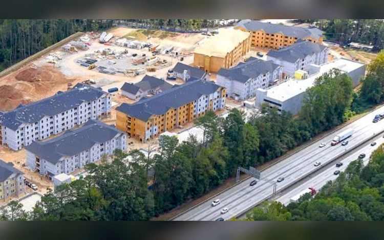 Near airport, project delivers 450 homes a year ahead of schedule