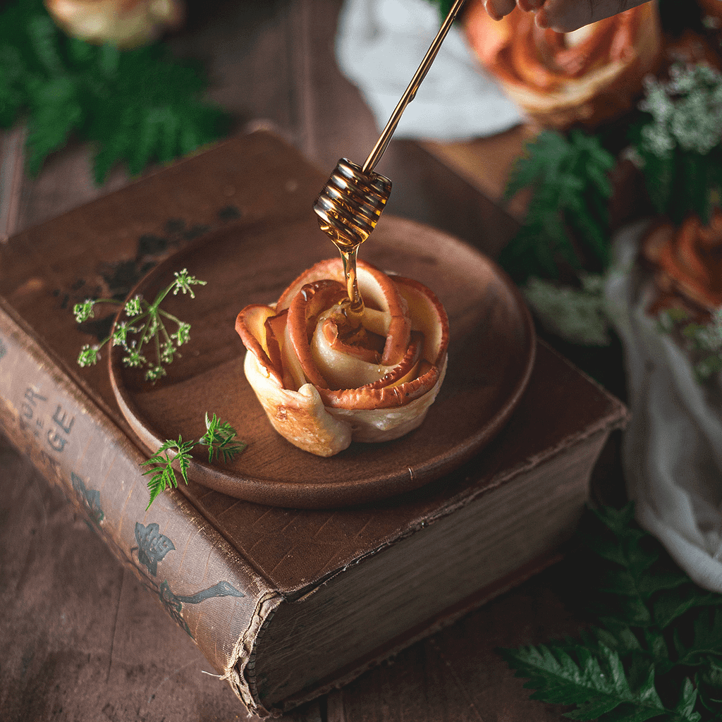 Single serving of apple pie drizzled with honey