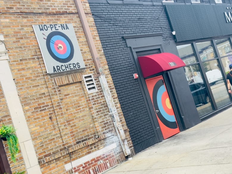 A brick building with a red awning and a red door with a target door

AI-generated content may be incorrect.