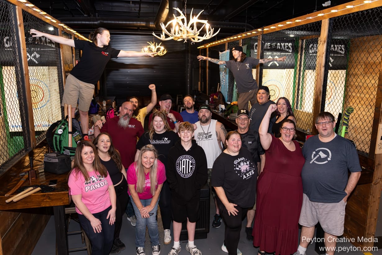 A group of people standing in a room

AI-generated content may be incorrect.