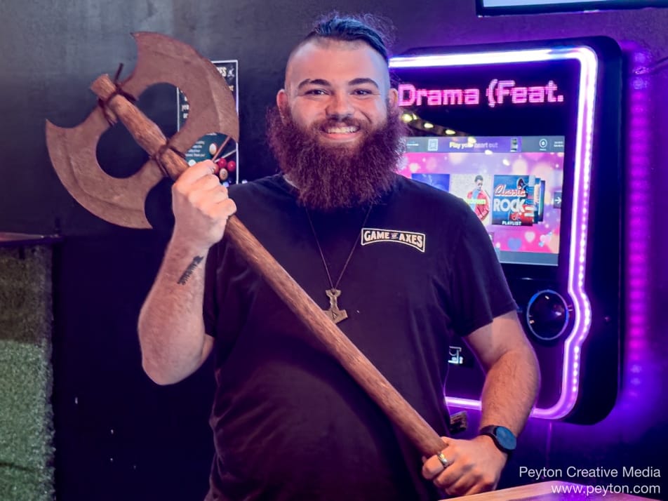 A person holding an axe

AI-generated content may be incorrect.