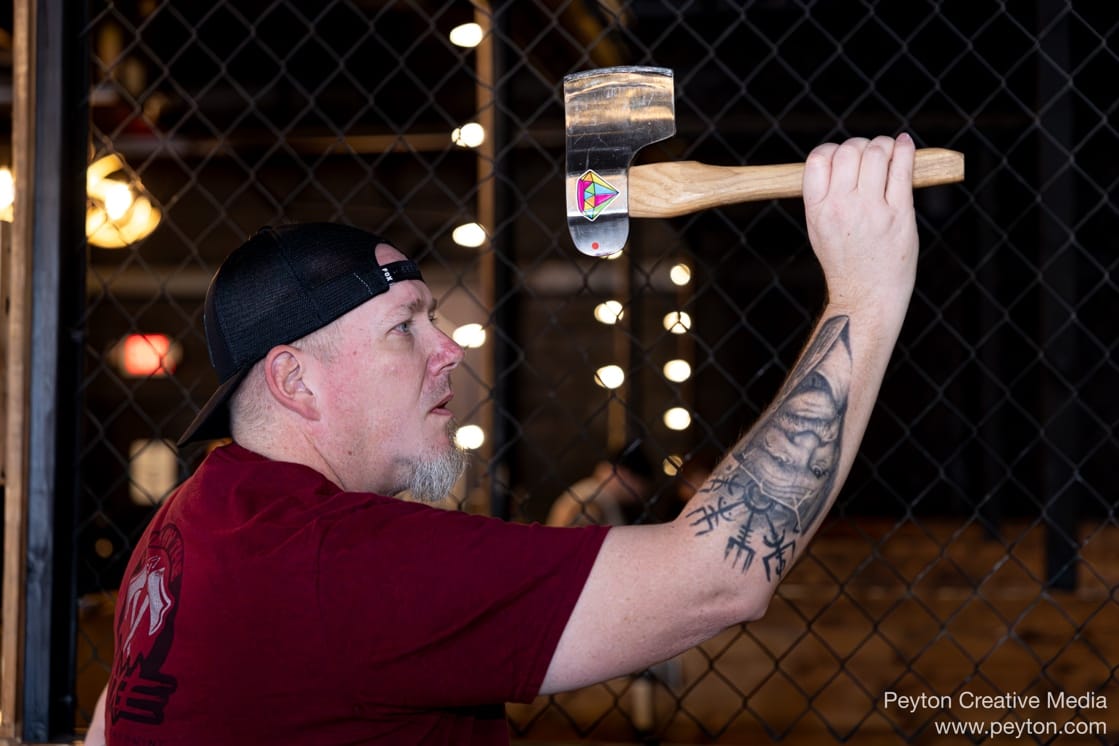 A person holding an axe

AI-generated content may be incorrect.