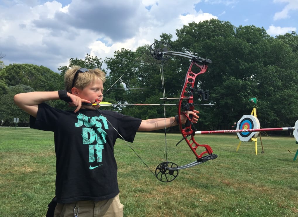 A child holding a bow and arrow

AI-generated content may be incorrect.
