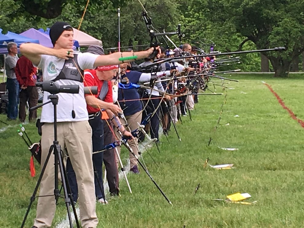 A group of people shooting bows

AI-generated content may be incorrect.