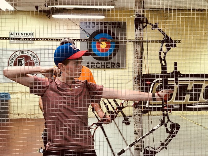 A person holding a bow and arrow

AI-generated content may be incorrect.