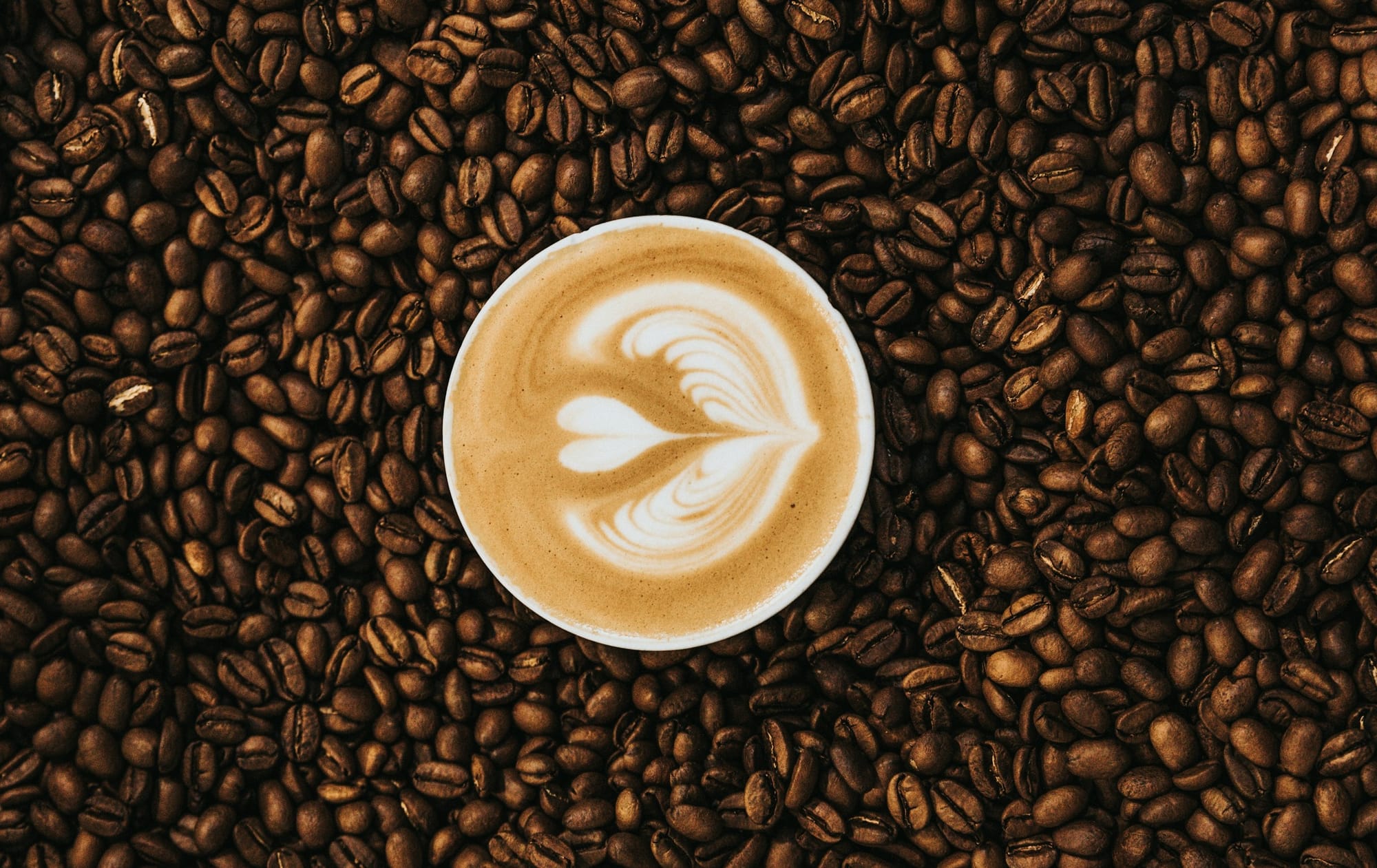 top view photography of heart latte coffee