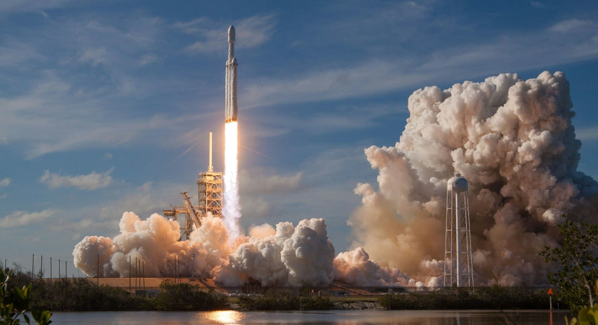 gray spacecraft taking off during daytime