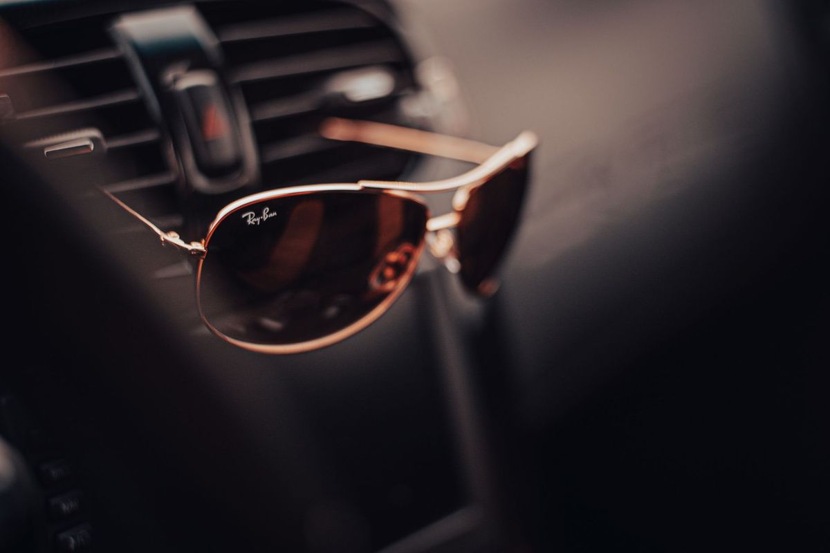 ray ban sunglasses on a car vent