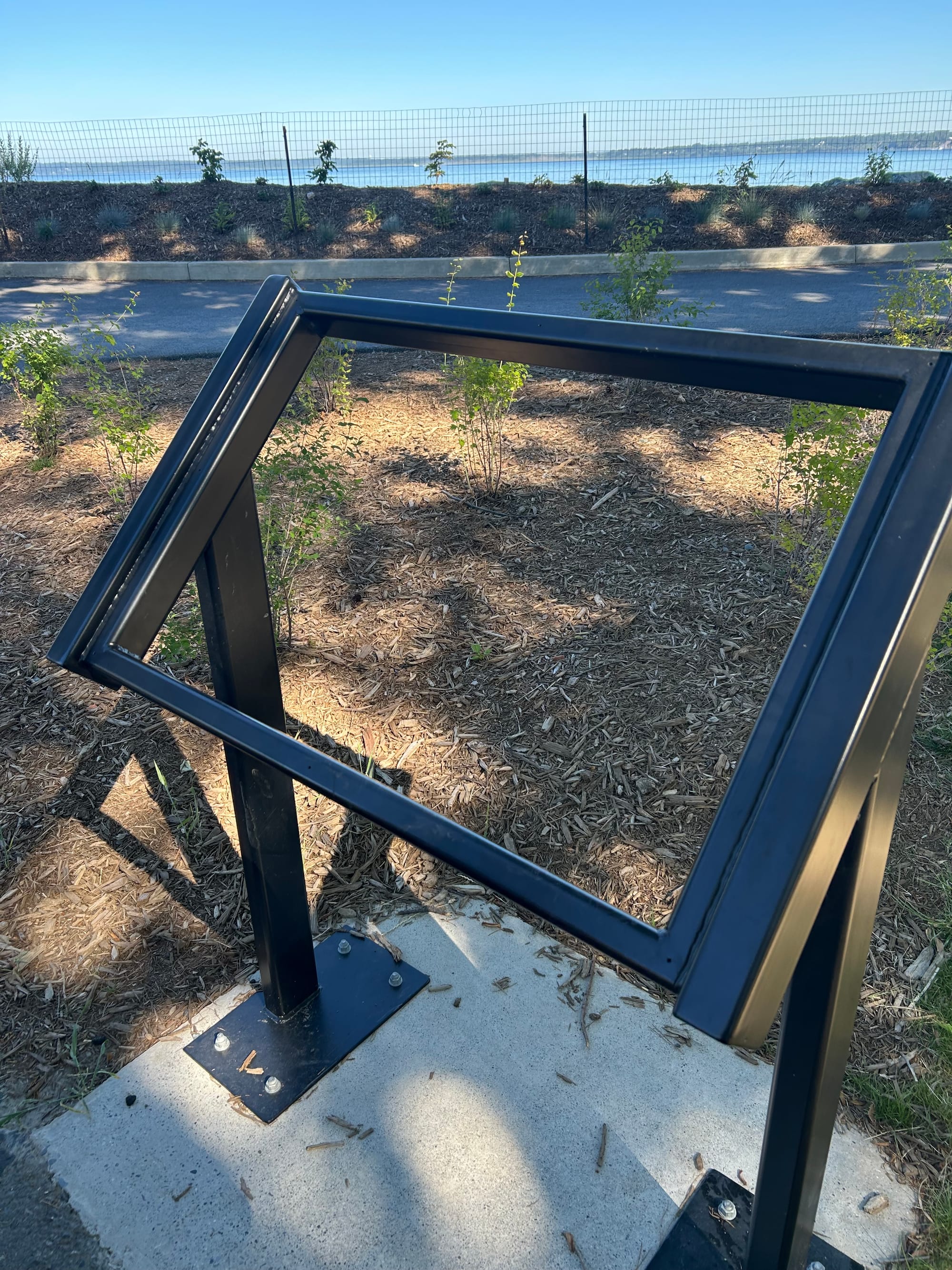 the metal frame for an informational plaque, but no plaque is inside